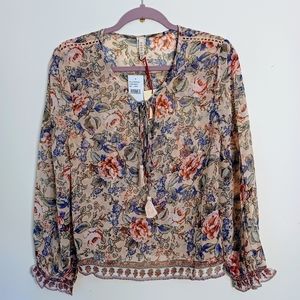 RAGA Victoria Tassel neck blouse in peach. NWT